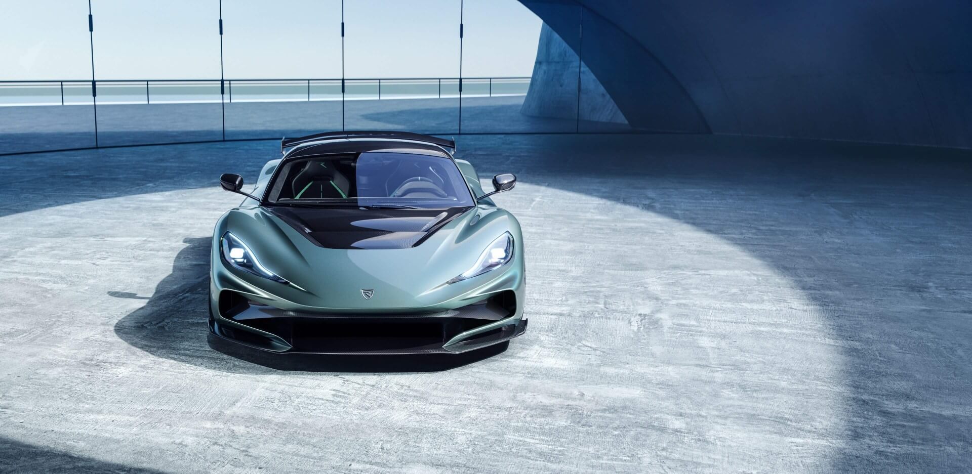 Nevera R inside a concrete hall - front view